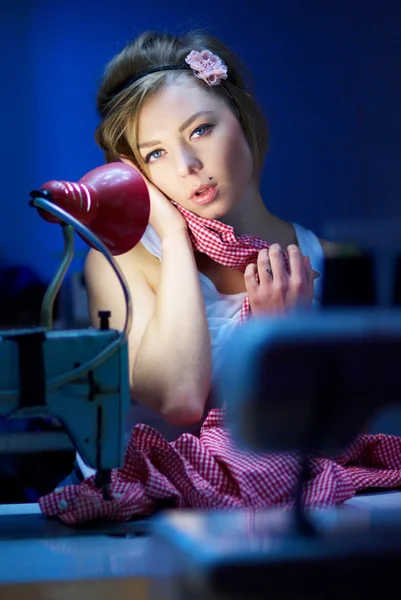 Seductive blond sewing in her workshop — Stock Photo, Image