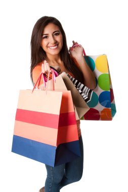 Happy young woman on shopping spree clipart