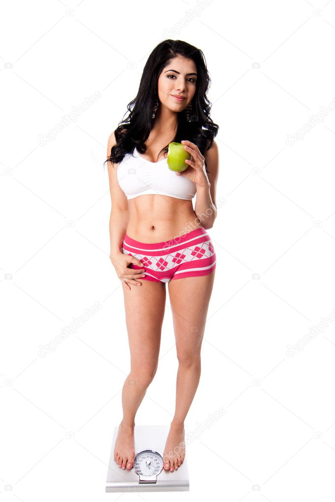 Weight concious woman with apple Stock Photo by ©phakimata 8757903
