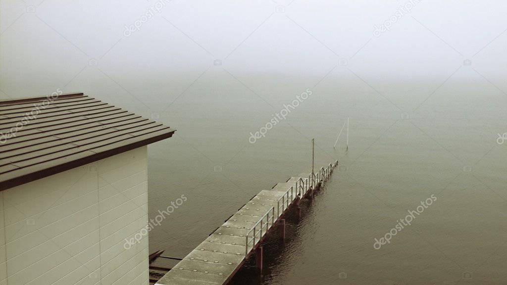 Old pier in mist