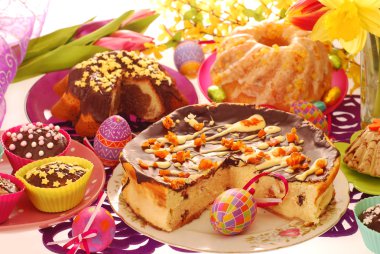 Easter confectionery on festive table clipart