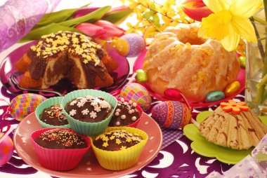 Easter confectionery on festive table clipart