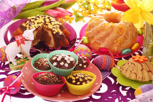 Easter confectionery on festive table Stock Photo