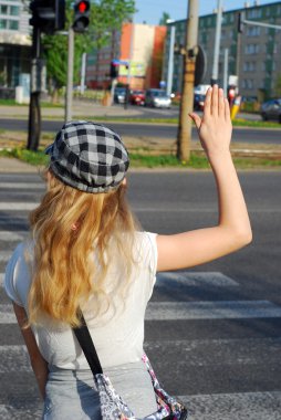 Young girl crossing the street clipart