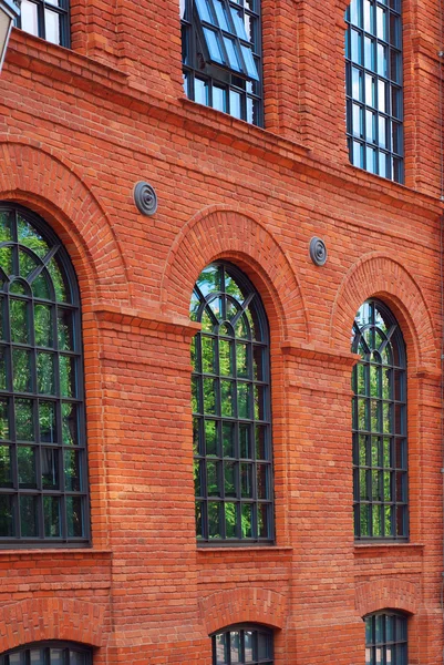 Windows of old building in restored shopping centre-Manufactura — Stock Photo, Image
