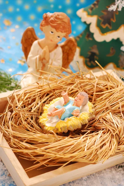Cena da natividade com o bebê Jesus e o anjo — Fotografia de Stock