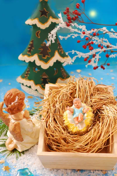 Cena da natividade com o bebê Jesus e o anjo — Fotografia de Stock