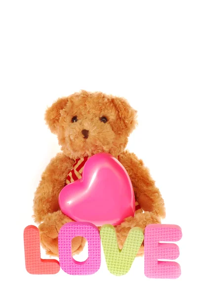 Teddy bear with pink heart — Stock Photo, Image