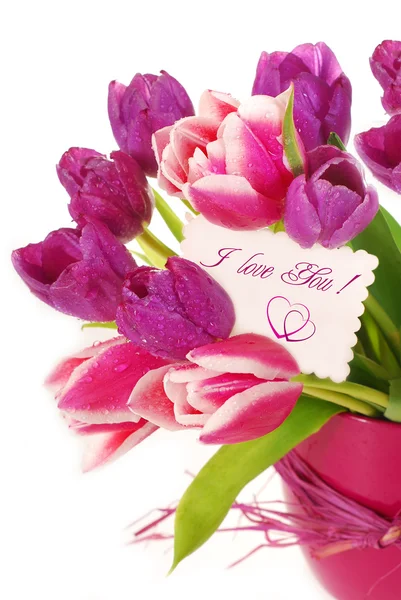 Manojo de tulipanes con tarjeta de felicitación — Foto de Stock