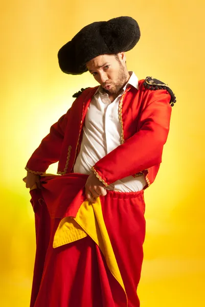 Bullfighter courage red yellow humor spanish colors — Stock Photo, Image