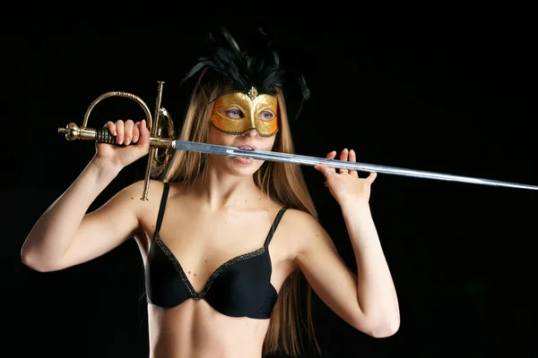 stock image The girl in a mask with a sword