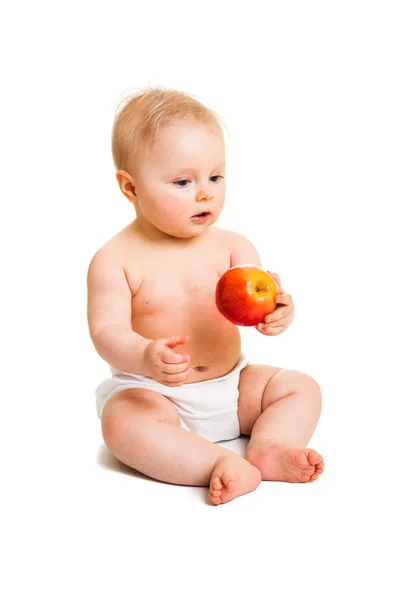 Ładny dziewczyna niemowląt z jabłkiem na białym tle — Zdjęcie stockowe