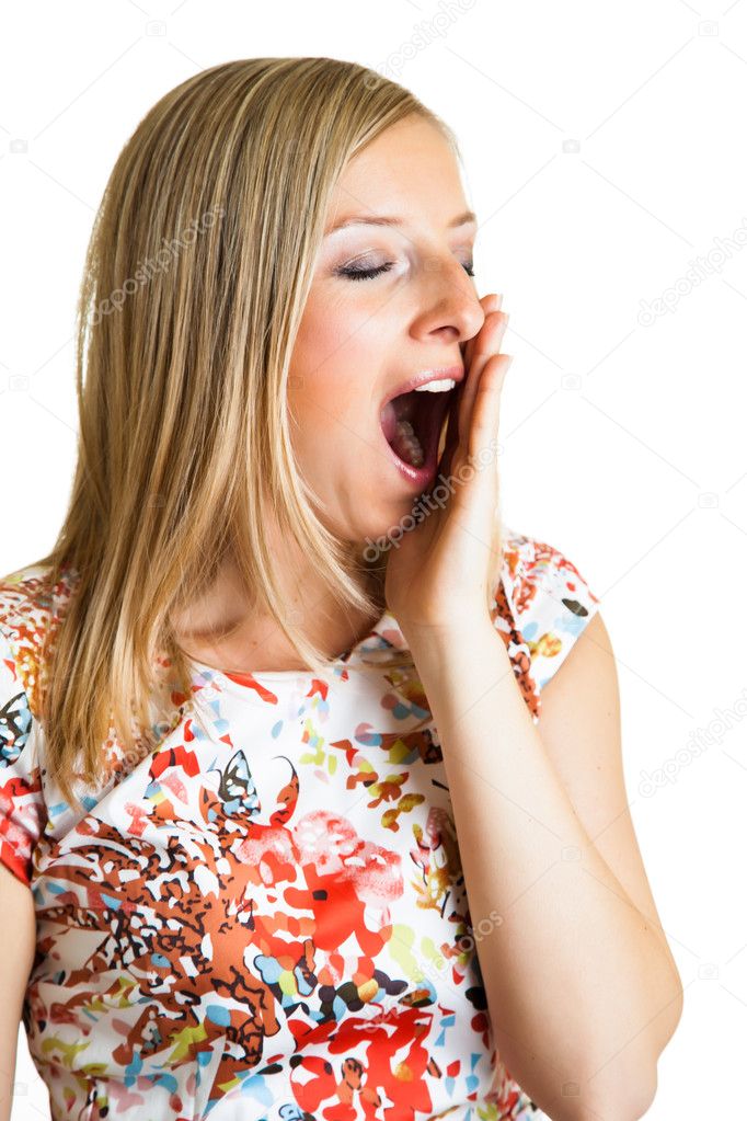 Yawning woman isolated on white