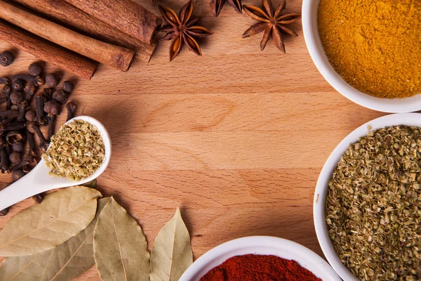 Frame composition of spices on wood, anise,cinnamon,pepper, laurel — Stock Photo, Image