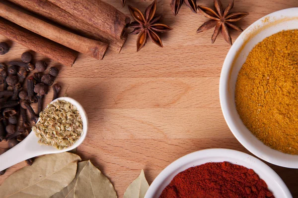 Frame composition of spices on wood, anise,cinnamon,pepper, laurel — Stock Photo, Image