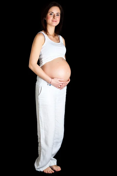 Gravid kvinna isolerade på svart — Stockfoto