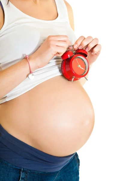 Zwangere meisje met klok verschuldigde datum concept — Stockfoto