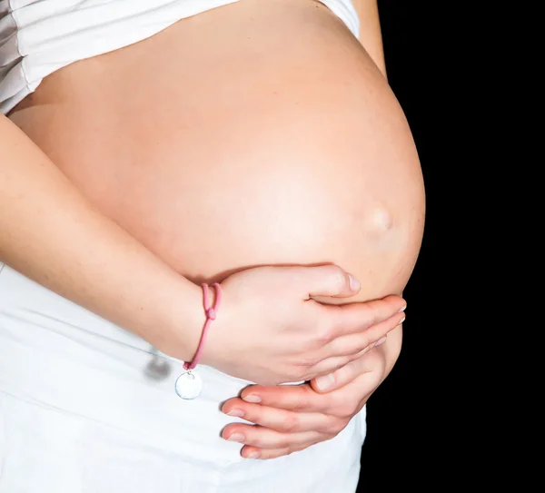 Hamile kadın üzerinde siyah izole — Stok fotoğraf