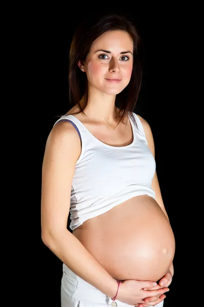 Έγκυος γυναίκα απομονωμένη σε μαύρο — Φωτογραφία Αρχείου