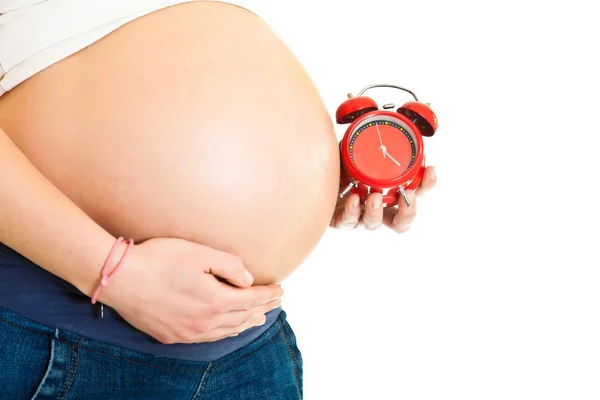 Беременная девушка с графиком родов — стоковое фото