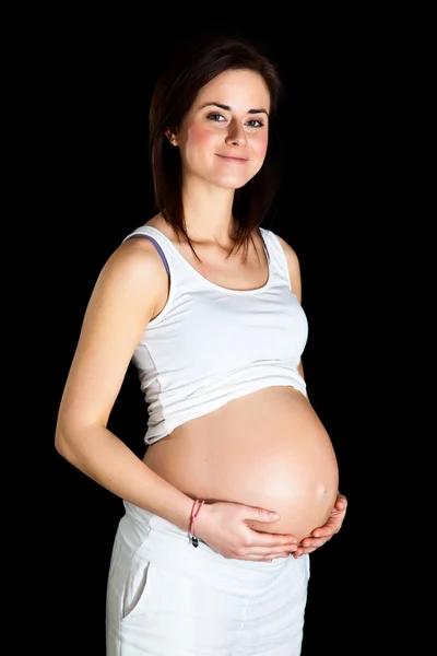 Pregnant woman isolated on black Stock Image