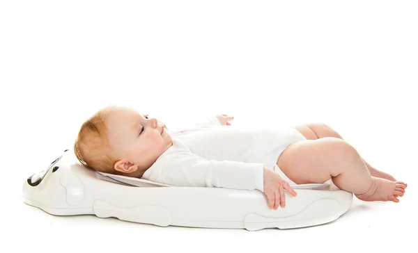 Weighting infant girl isolated on white — Stock Photo, Image