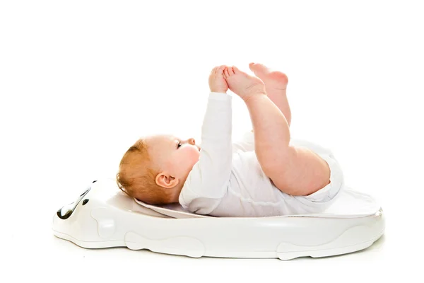 Gewichtung Säugling Mädchen isoliert auf weiß — Stockfoto