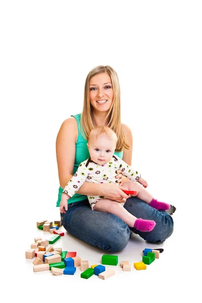 Spädbarn flicka som leker med Murtegel isolerad på vit — Stockfoto