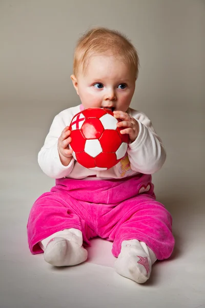 stock image Infant girl playing in room on wooden floor