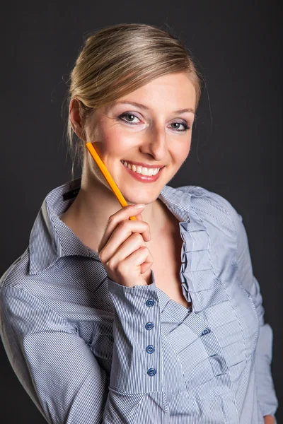 stock image Businesswoman has ideas on gray background