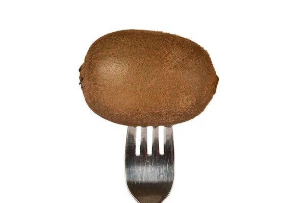 Kiwi pierced on a fork over a white background — Stock Photo, Image