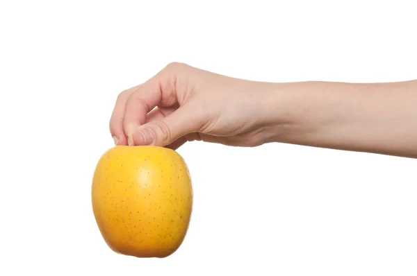 Mujer mano sosteniendo manzana sobre un fondo blanco —  Fotos de Stock