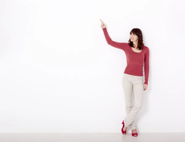 Showing something on a white wall — Stock Photo, Image