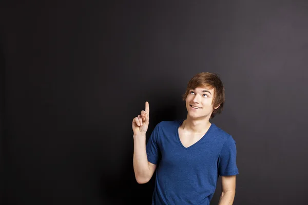 Young man over a chalk board — Stock Photo, Image