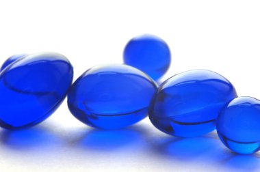 Abstract pills in blue color clipart