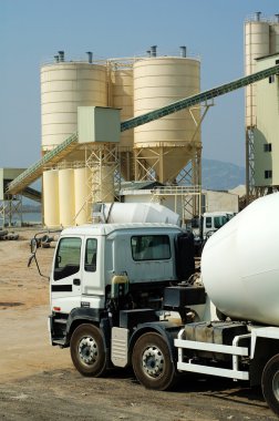 The mixer truck in cememt plant clipart