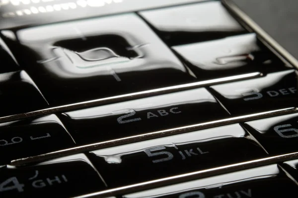 Modrý mobilní klávesnice do tmy — Stock fotografie
