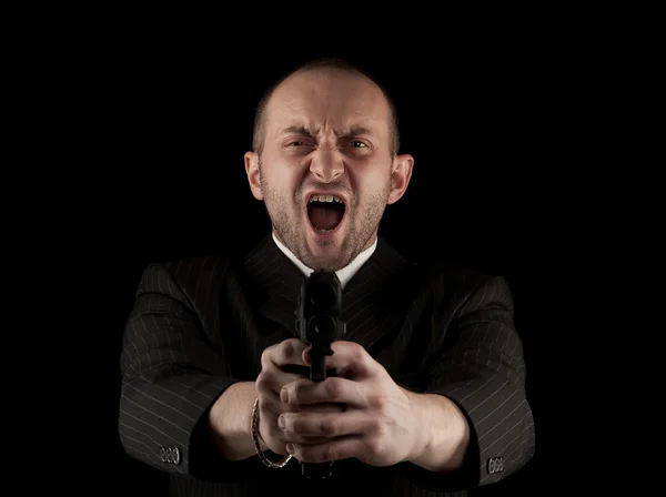 Hombre enojado sosteniendo pistola — Foto de Stock