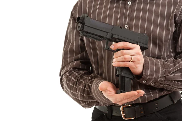 Ręce przeładować pistolet — Zdjęcie stockowe