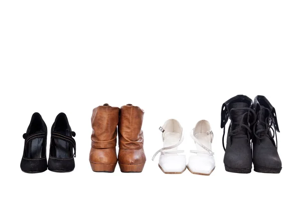 Четыре пары разных туфель — стоковое фото