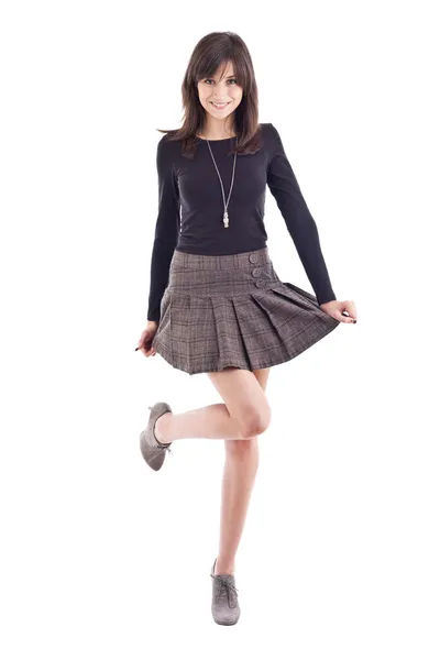 Vacker flicka poserar i kort kjol — Stockfoto