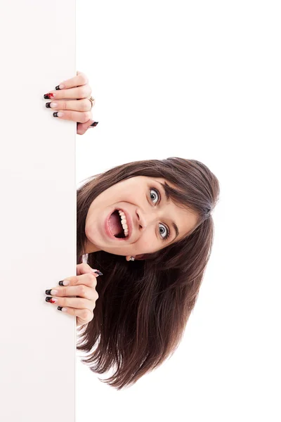 Chica sorprendida mirando la cartelera blanca — Foto de Stock