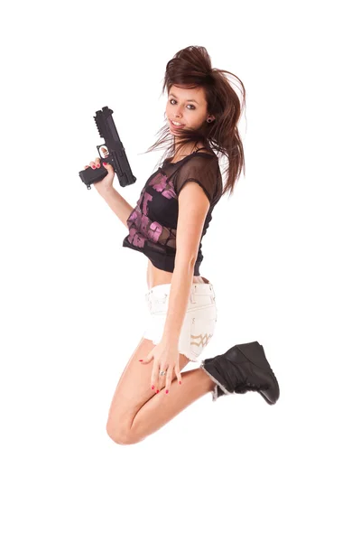 Chica con pistola saltando —  Fotos de Stock