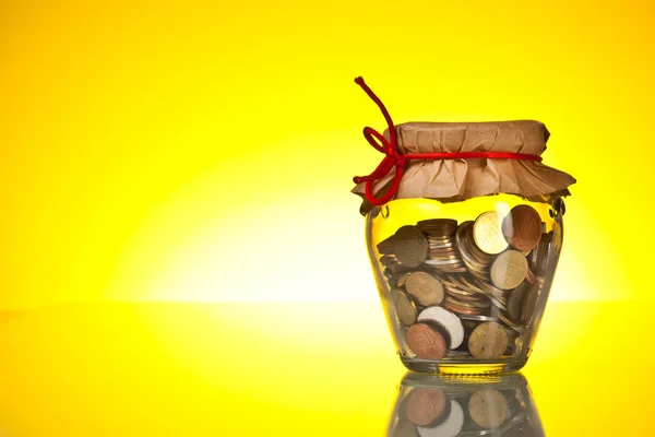 Coins in money jar — Stock Photo, Image