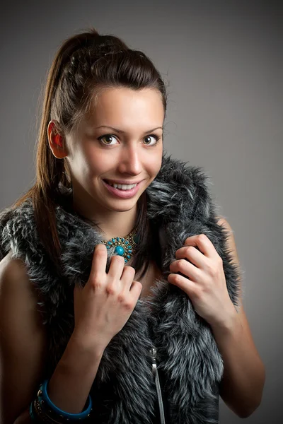 Girl is in fur clothes — Stock Photo, Image