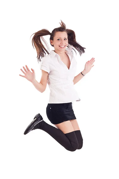 Meisje in zwarte korte rok springen — Stockfoto