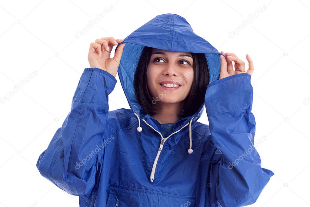 Young women in a blue rain coat