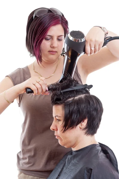 Estilista secado mujer cabello —  Fotos de Stock
