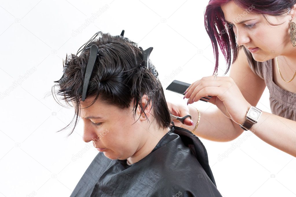 Hairdresser making haircut