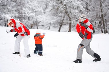 Family playing with snow clipart